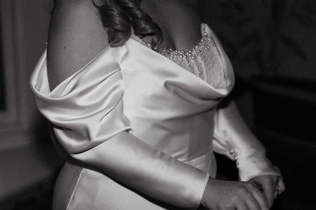 A b+w image of a bride getting dressed for her Philadelphia wedding 