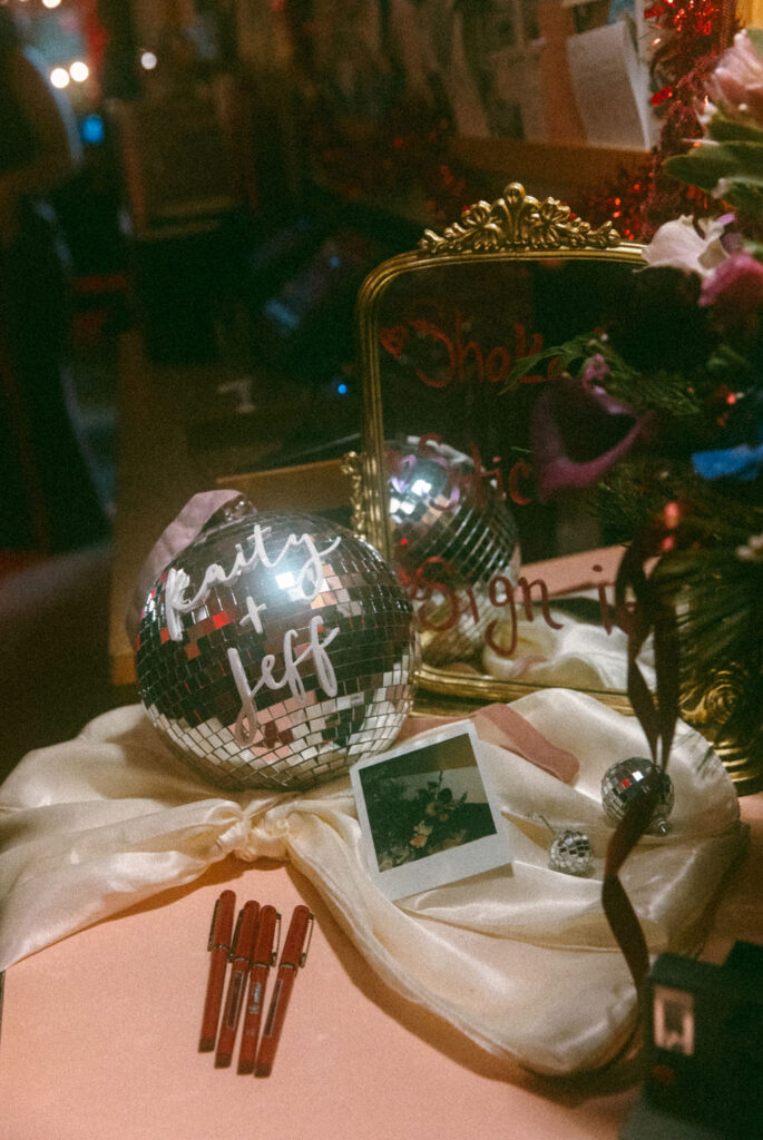 Wedding details including a disco ball and polaroids are shown at a Philadelphia wedding 